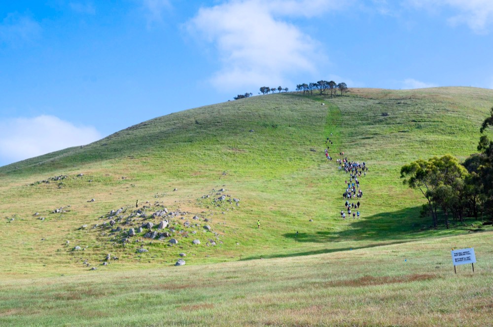 Athletes climbing the hill at King of the Hill